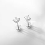 Close-up of luxury diamond stud earrings showcasing elegance and simplicity.
